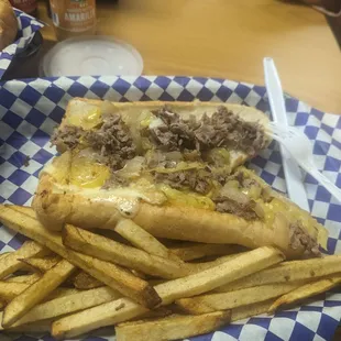 Half Philly Cheese Steak and seasoned fries