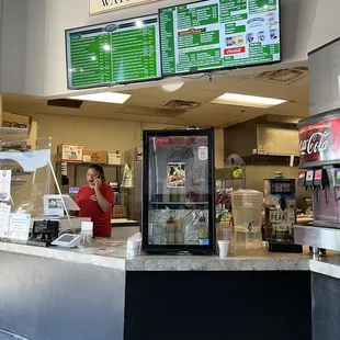 a woman behind the counter