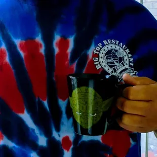 a man holding a coffee mug
