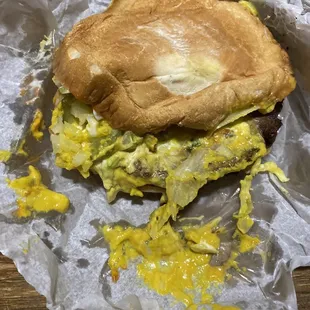 Burger covered in mustard