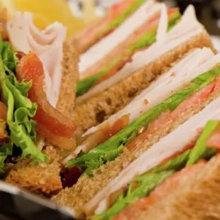 a tray of sandwiches on a table