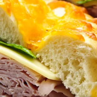 a sandwich with meat and cheese