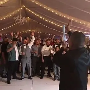 Tent with swag lighting and chandelier