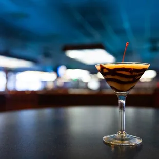 a chocolate drink in a martini glass