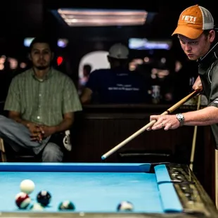 a man playing pool