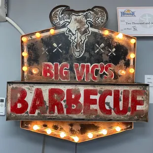a neon sign for a barbeque