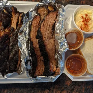 Ribs, brisket, potato salad, and fixings