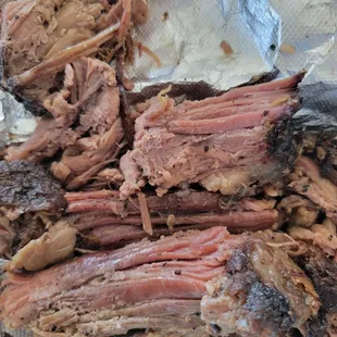 Brisket, cut with the grain and in scraps rather than slices.