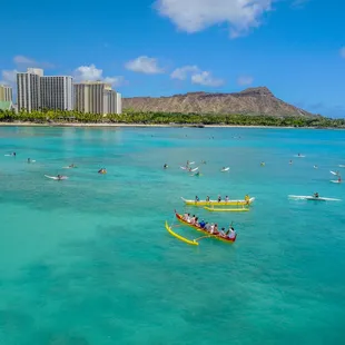 Outrigger canoe rides, a must do in hawaii, we surf the canoe on the waves along the surfers