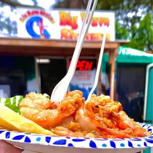 Garlic Butter Shrimp with Cesar Salad, Rice, &amp; a small slice of pineapple.
