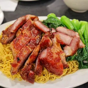 a plate of food with meat and noodles