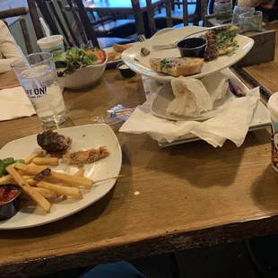 Pile of plates that were not cleared off til we left. Not even the appetizer. See "kid's side salad".