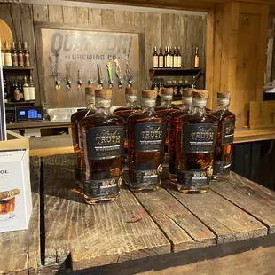 bottles of whiskey on a wooden table