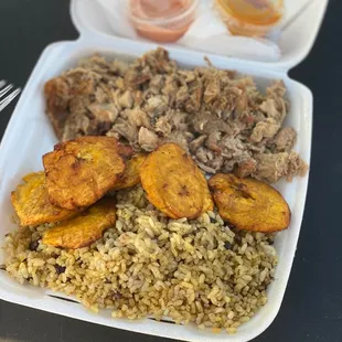 Puerto Rican Rice with Pulled pork and fried plantains.