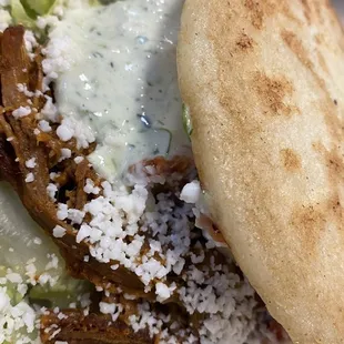 Arepa carne mechada (arepa with pulled or jerked meat)