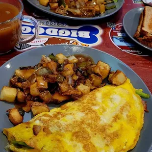 an omelet with a side of potatoes