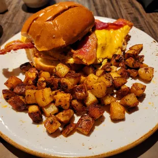 The Open Wide breakfast sandwich... Includes: brioche bun, cheesy eggs, roasted tomato, bacon &amp; herb spread