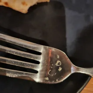 Crusted food on fork