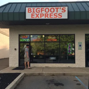 a man standing in front of a bigfoot's express