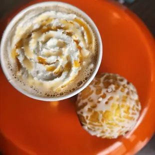 a cup of coffee and a doughnut