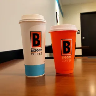 two coffee cups on a table