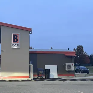 a parking lot with a coffee shop