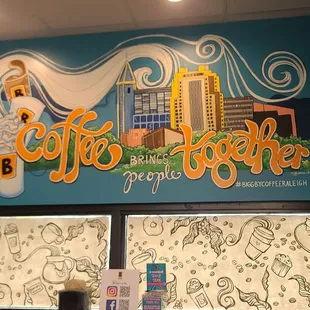 a mural on the wall of a coffee shop