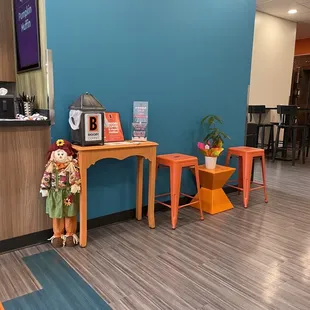 a small table with a microwave on it