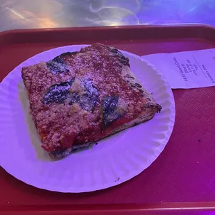 Grandma's Slice (one slice is enough). Topped with parm, romano, and basil. It's a dim place inside, almost like a bar, thus the low light.