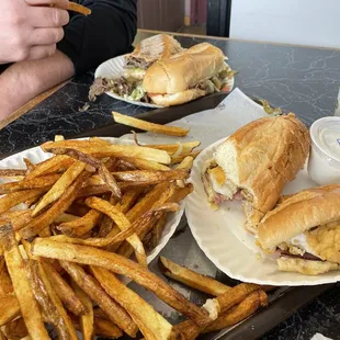 Ham stinger, plain (chicken ham and cheese like a chicken cordon bleu) and a steak and cheese with fries