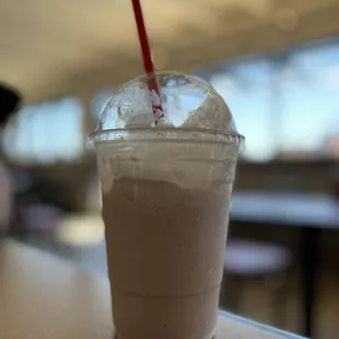 a smoothie in a plastic cup