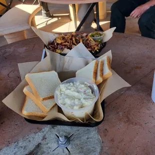 Tray with 2 sides potatoesalad &amp; delicious pork'nbeans next to appetizer hog wild fries super delicious