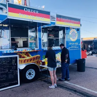 people ordering food from a food truck