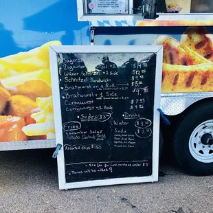 a menu on the side of a food truck