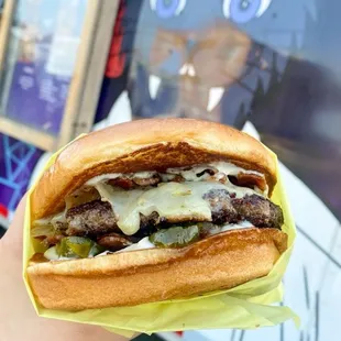 Last chance burger (Brioche Bun -6ozAll-Beef Patty -Herbed Aioli -PepperJack Cheese -bacon -Fresh Diced White Onion -Candied Jalapeños)