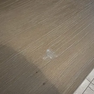 Scuff to main surface from shelf falling on it. It won't scrub off, I tried. :(