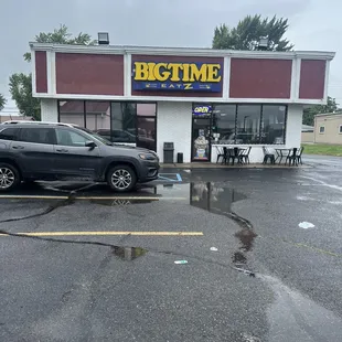 a car parked in front of a bigtime restaurant