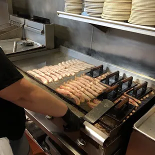 Bacon being cooked for catering this morning