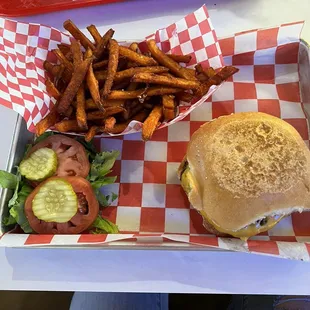 Single cheese burger, well done on sour dough bun, sweet potato fries.