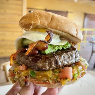 Chalupa burger with added avocado, bacon, and a sunny side egg