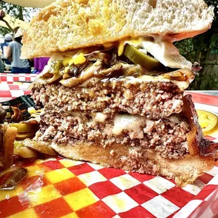 Double patty topped with a runny fried egg, stacked with sauteed mushrooms, braised onions, jalapeños and provolone cheese