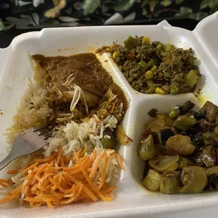 a meal in a styrofoam container