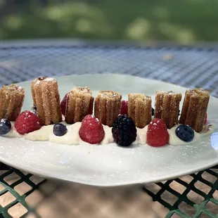 a plate of desserts on a table