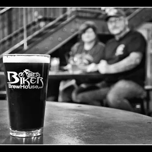a pint of beer on a table