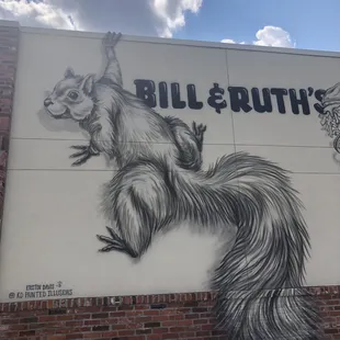 a squirrel on a wall