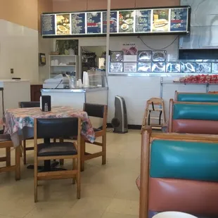 Cute cashier counter open to dining area.