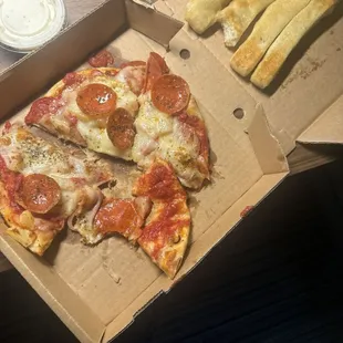 Sloppy mess,  breadsticks were cold.