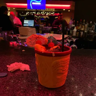 a cocktail in a plastic cup