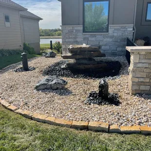 a fire pit in front of a house