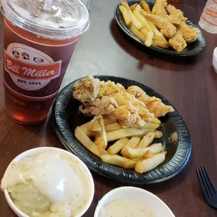a plate of fries and a drink